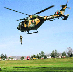Army personnel of the Rajput Regiment during a mock drill, Mountain Rescue, at the Annandale ground in Shimla on Tuesday. 