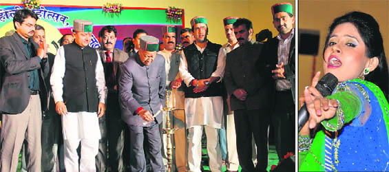 Chief Minister Virbhadra Singh lights the lamp to inaugurate the cultural evening at Sujanpur on Monday and (right) Punjabi singer Miss Pooja performs on the first evening of the Holi festival.