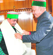 Chief Minster Virbhadra Singh honours MP Abhijit Mukherjee in Shimla on Tuesday. 