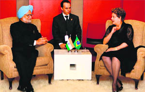 Prime Minister Manmohan Singh with Brazil's President Dilma Rousseff during a bilateral meeting ahead of the BRICS Summit in Durban on Tuesday. 