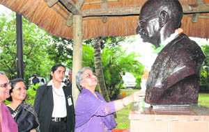 Gursharan Kaur, Prime Minister Manmohan Singhs wife, pays homage at the Mahatma Gandhi Ashram on the outskirts of Durban on Tuesday.