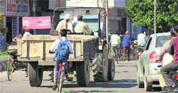 Despite ban, a tractor-trailer being openly used for commercial purposes at Guru Nanak Mission Chowk in Jalandhar.