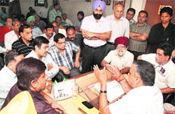 Representatives of the Mahanagar Sangharsh Committee meet MLA KD Bhandari regarding property tax in Jalandhar on Tuesday. 