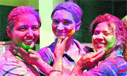 On the eve of the festival of colours, college students celebrate Holi in Jalandhar. 