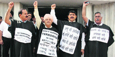 BJP legislators stage a protest against Chief Minister Omar Abdullah outside the Assembly in Jammu on Tuesday.