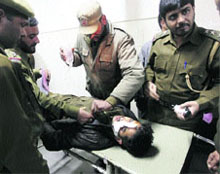 An injured policeman being taken to a hospital in Srinagar on Tuesday