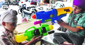 Children play with water guns