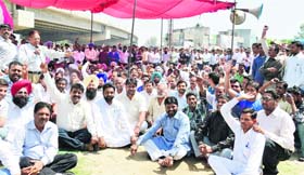 Activists of the Dalit Adhikar Bachao Morcha hold a rally on the Jalandhar bypass in Ludhiana on Tuesday