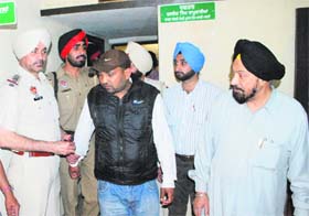 The accused, Gurdish Singh (in black jacket), in police custody in Ludhiana on Tuesday