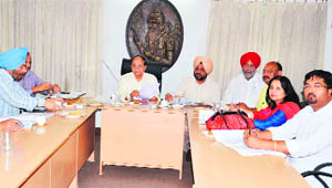 Mayor Bakshi Ram Arora Mayor (centre) chairs the F&CC meeting in Amritsar on Thursday.