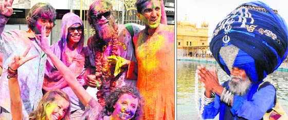 Foreigners enjoy Holi celebrations; and a Nihang (right) wearing a 300-metre-long turban on the occasion of Hola Mohalla at Golden Temple in Amritsar on Thursday.