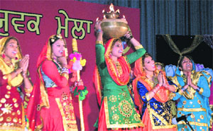 Girls perform giddha during a state-level youth festival in Mohali.