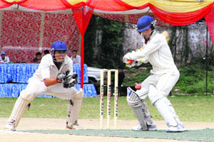  A batsman in action during a match in the 5th All-India Uttarakhand Cricket Cup-2013 in Dehradun on Thursday. 