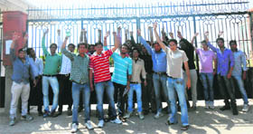 Students protest outside the locked main gate of the Sonepat Institute of Engineering and Management on Thursday.
