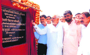 Former Speaker Raghuvir Kadian lays the foundation stone of a waterworks at Chhara village in Jhajjar. 