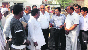 The team members of the National Commission for Scheduled Castes meet the family members of the deceased at Khewra village in Sonepat district. 