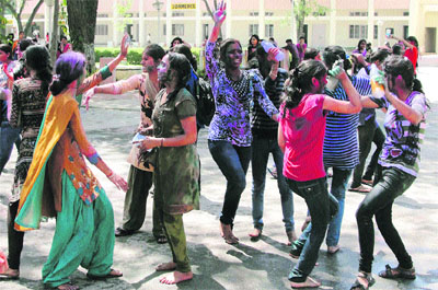 Girls of Government College for Women celebrate Holi, the festival of colours, in Gurgaon. 