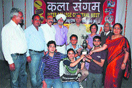 The winning team of MN College, Shahabad, receives a trophy from Dr DD Arora (fifth from left), Dean of Colleges, Kurukshetra University, for the inter- college competitions on the premises of Arya Kanya Mahavidayala, Shahbad (M). 