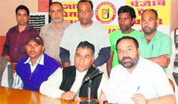 State general secretary of the BSP Sukhwinder Kotli and district general secretary Kamal Dev Jandusingha address mediapersons in Jalandhar. Tribune photo: Malkiat Singh