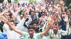 PDD daily wagers protest in Jammu on Thursday. Tribune photo: Anand Sharma 