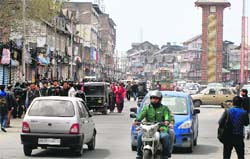 Private vehicles ply normally during a bandh in Srinagar on Thursday. Tribune photo: Amin War 