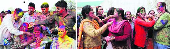 BSF personnel and (below) their family members celebrate Holi in Srinagar on Wednesday. Tribune photos: Amin War