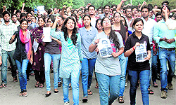 Students of the National Institute of Pharmaceutical Education and Research protest outside the campus in Mohali on Friday
