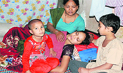 Victim's wife Seema being comforted by her mother as her two daughters look on at Sector 4, Panchkula, on Friday