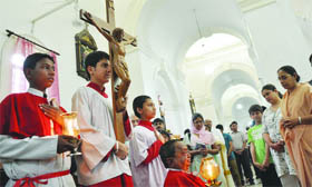 Christian devotees praying in Sacred Heart Cathedral on Good Friday in New Delhi.