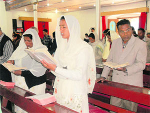 Devotees pray at the central methodist church in Mussoorie on the occasion of Good Friday