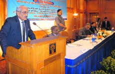 Justice Swatanter Kumar (retd) adresses a seminar on environment and development in Mussoorie on Friday.