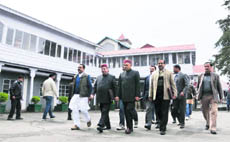 Leader of Opposition PK Dhumal and other BJP legislators go to the Assembly during the Budget session in Shimla on Friday.