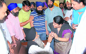 School principal Deepa Dogra interacts with parents of Amandeep and Sikh organisations in Jalandhar on Friday. 