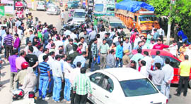 Parents of students of KC International School block the Jammu-Poonch National Highway.