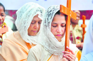 Christians take part in a holy march on the occasion of Good Friday at Dugri in Ludhiana.