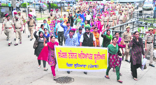 Members of the Special Trainers Teachers Union hold a protest rally in Ludhiana.