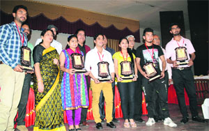 Students with their trophies during the annual prize distribution function at Arya College in Ludhiana. 