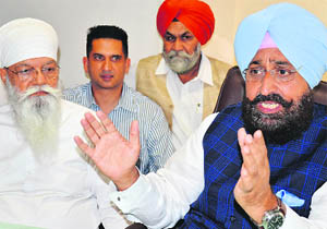 Pradesh Congress chief Partap Singh Bajwa (right) talks to mediapersons at Bhaini Sahib on Friday. 