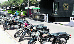 Students park their Royal Enfield motorcycles outside the entrance gate of Guru Nanak Dev University as the varsity has banned these motorcycles from entering the campus in Amritsar
