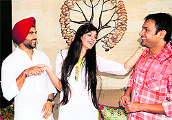 Singer-actor Amrinder Gill and Yuvika Chaudhary promote their film Daddy Cool Munde Fool in Amritsar on Saturday