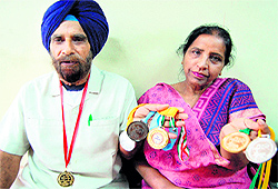 Jarnail Singh and Gurmeet Kaur with their medals in Amritsar on Saturday