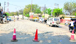 Temporary repairs are being conducted on a portion of the Bibiwala Road in Bathinda on Saturday.