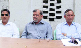 Trivendra Singh Panwar, president of the Uttarakhand Kranti Dal, addresses a press conference in Dehradun on Friday.