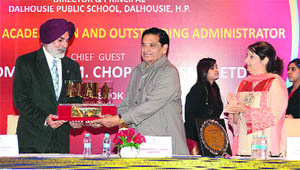 Dr GS Dhillon receives an award from Rear Admiral (retd) MM Chopra in New Delhi on Saturday.