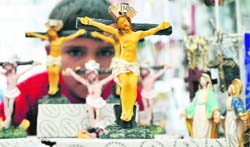 A devotee participates in the procession to mark Good Friday, the day when Jesus Christ was crucified. Easter falls on the Sunday folowing Good Friday and it is believed that Christ came back to meet his followers on Easter. tribune Photo: Inderjeet Singh