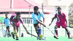 Players in action during the Senior District Hockey Championship at KK Hakhu Astroturf Stadium in Jammu on Saturday. Tribune Photo: Inderjeet Singh