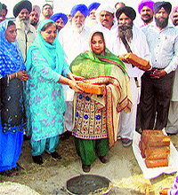 Former Punjab minister Upinderjit Kaur lays the foundation stone of a government school at Desal village falling under the Sultanpur Lodhi Assembly segment in Kapurthala district on Saturday