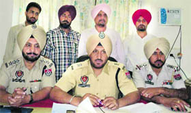Police officials at a press conference at the CIA office, Khanna, on Saturday.