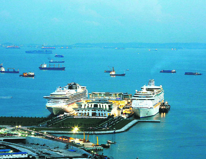 The Diamond Princess and Voyager of the Seas docked at the Marina Bay Cruise Centre (MBCCS) in Singapore.