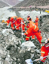Rescuers search for survivors at the site of a landslide in Maizhokunggar County in Tibet on Saturday.